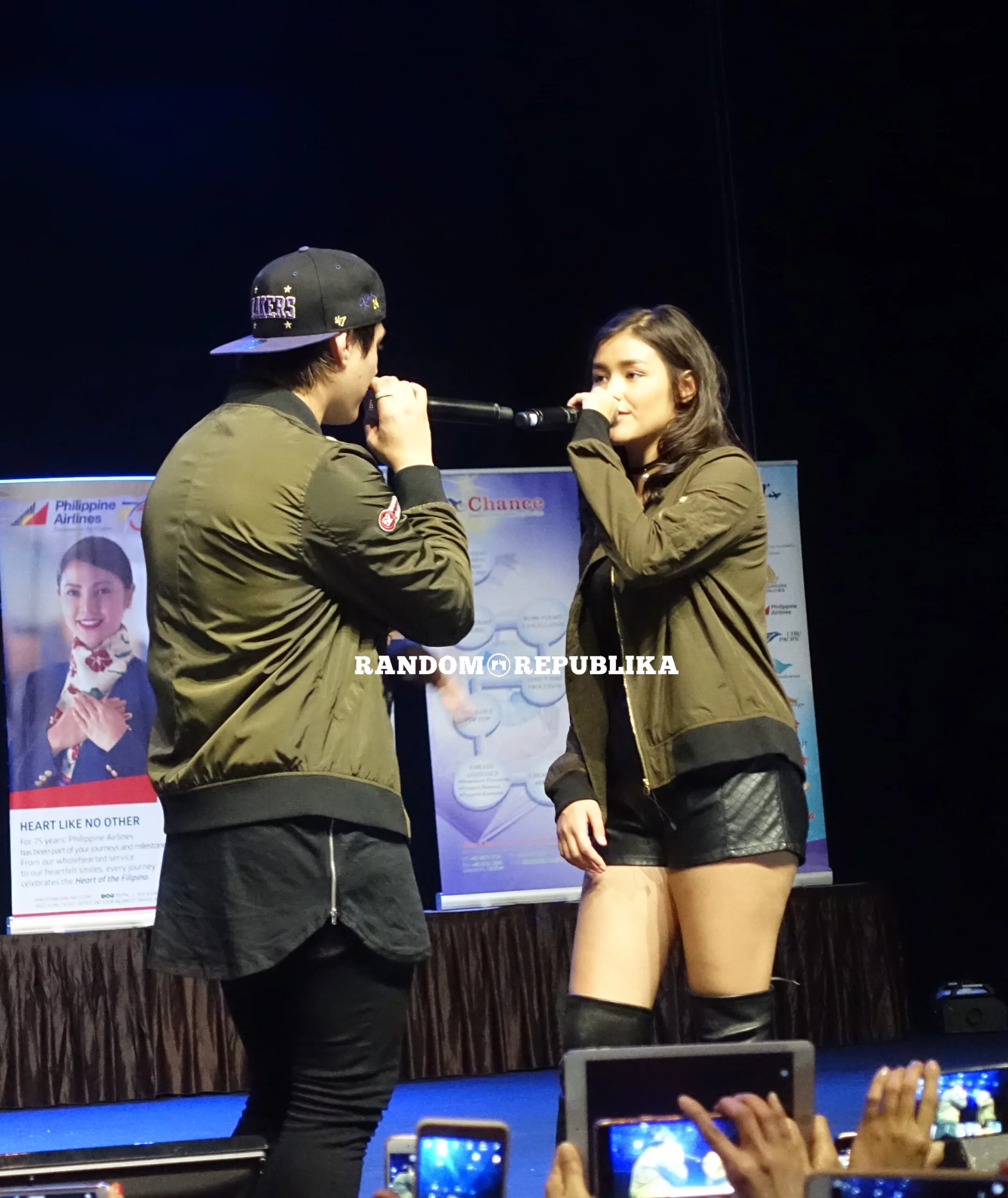 couple jackets singing lizquen live in singapore with filipino dance club singapore